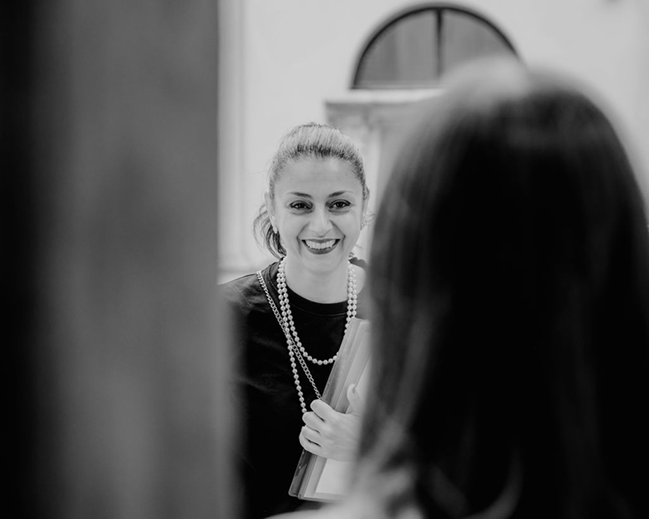 Barbara, founder of Extraordinary Weddings Italy, smiling at a couple
